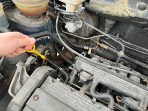 Checking oil level with yellow dipstick